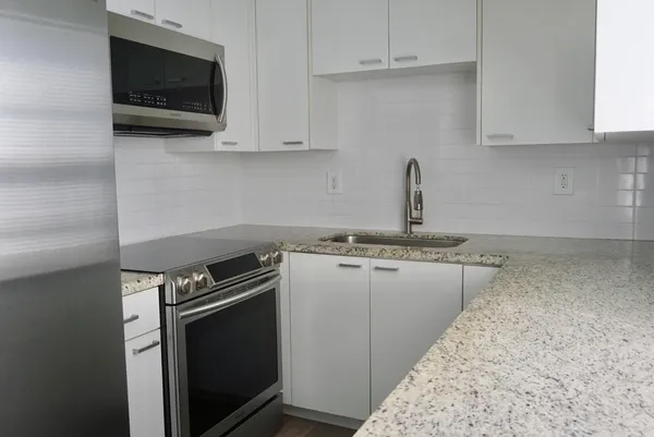 a kitchen with a stove and a microwave