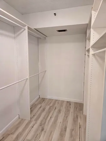 a view of an empty room with windows