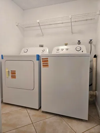 an empty room with a empty space and windows