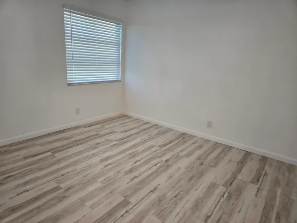 a view of a lake with houses in the back