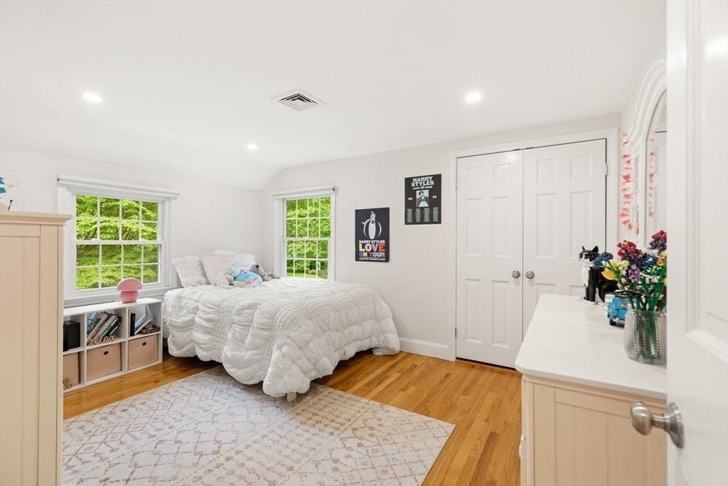 105 Thornberry Road Winchester, MA 01890 - Photo 21 of 35 a bedroom with a bed table and a window