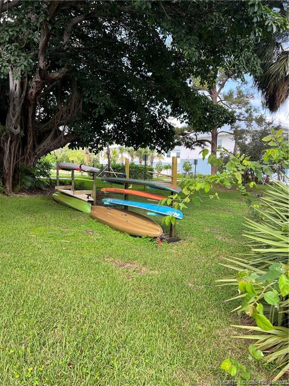 4885 Southeast Capstan Avenue, Unit E27 Stuart, FL 34997 - Photo 31 of 40 a garden view with a sitting space