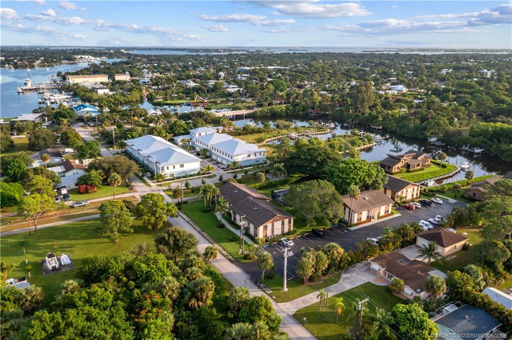 4885 Southeast Capstan Avenue, Unit E27 Stuart, FL 34997 - Photo 35 of 40 an aerial view of residential houses with outdoor space