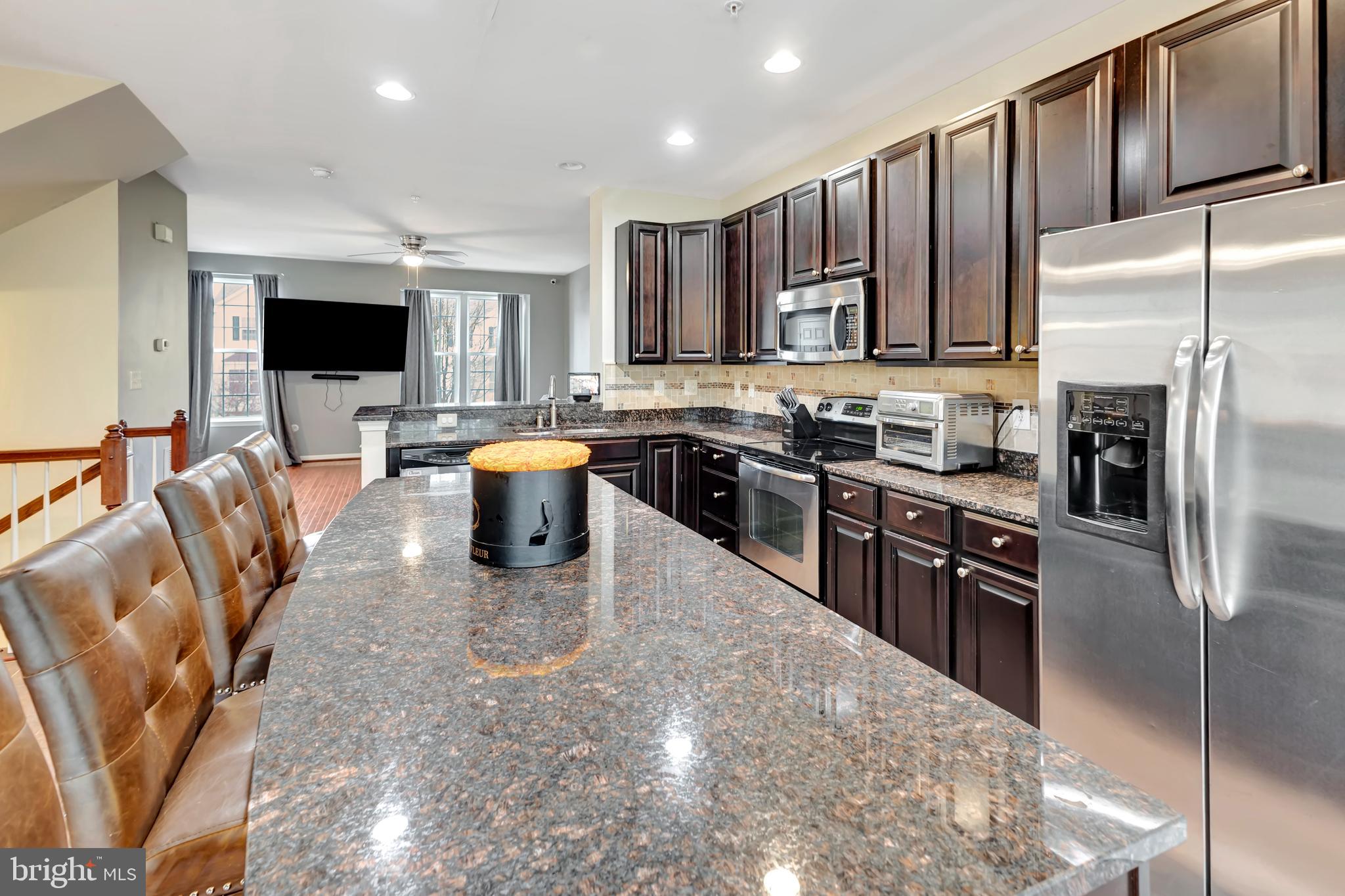 2063 Spring Run Circle Frederick, MD 21702 - Photo 13 of 28 a kitchen with stainless steel appliances granite countertop a refrigerator stove top oven a sink and dishwasher
