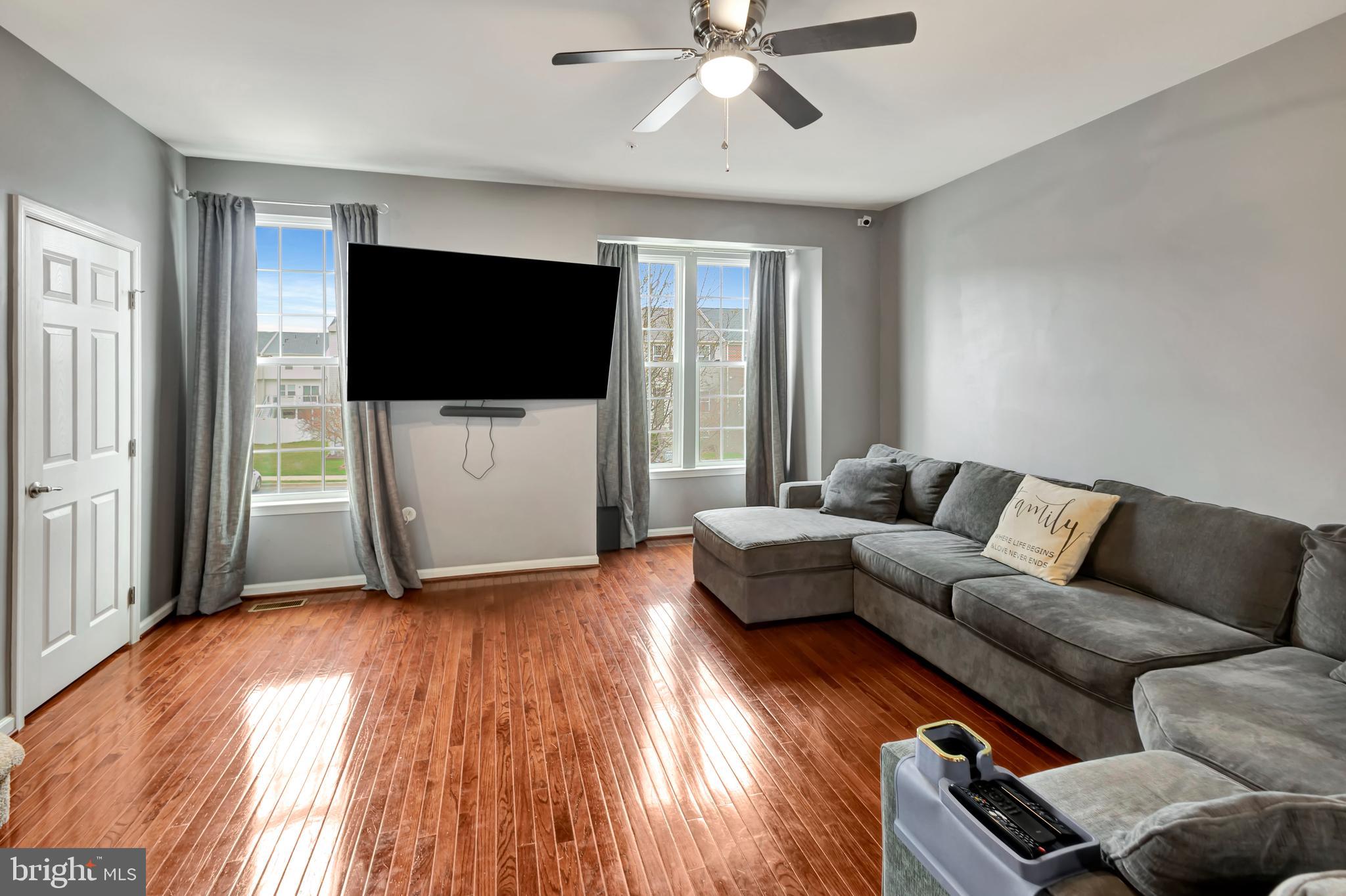 2063 Spring Run Circle Frederick, MD 21702 - Photo 15 of 28 a living room with furniture and a flat screen tv