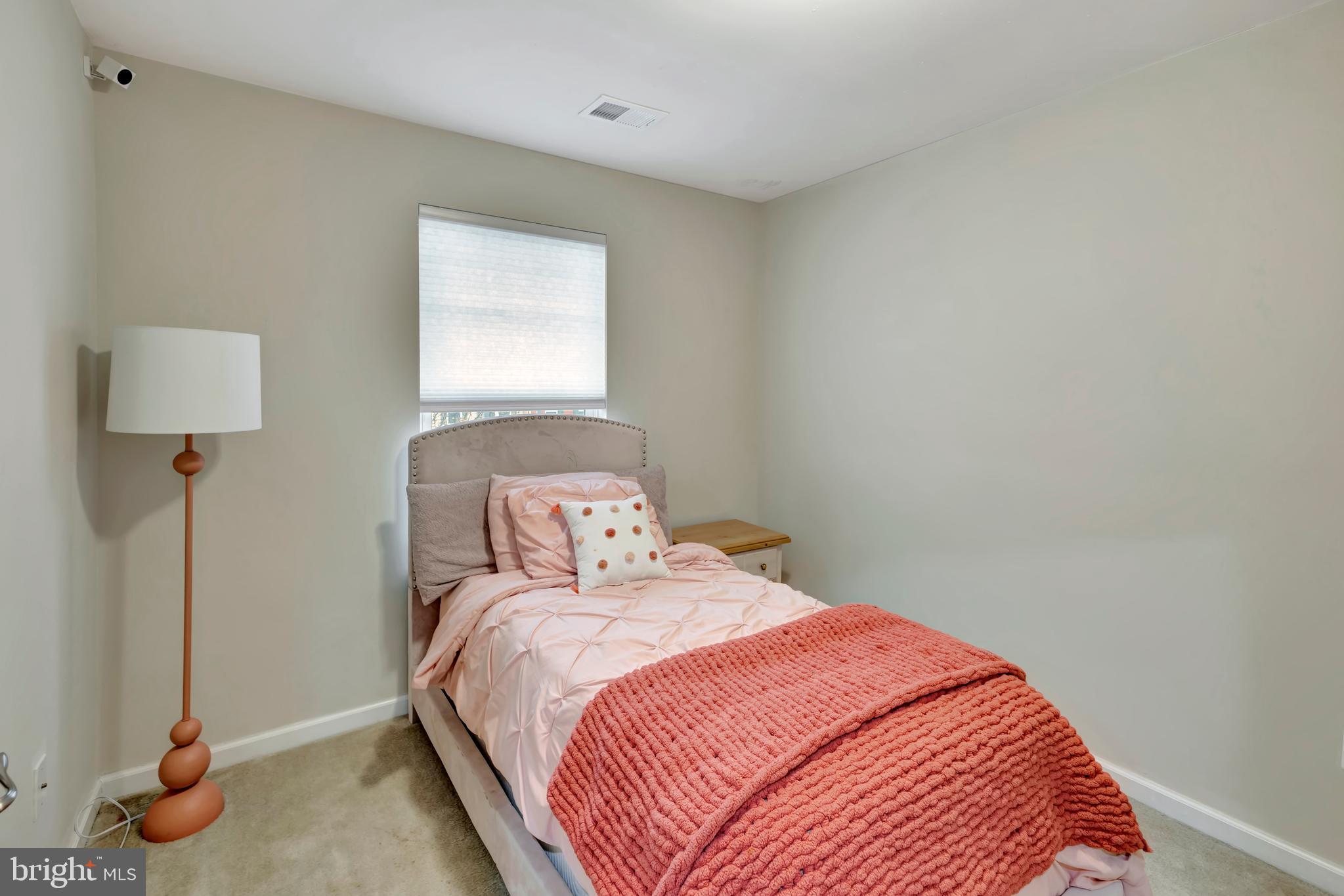 2063 Spring Run Circle Frederick, MD 21702 - Photo 23 of 28 a bedroom with a bed and a lamp