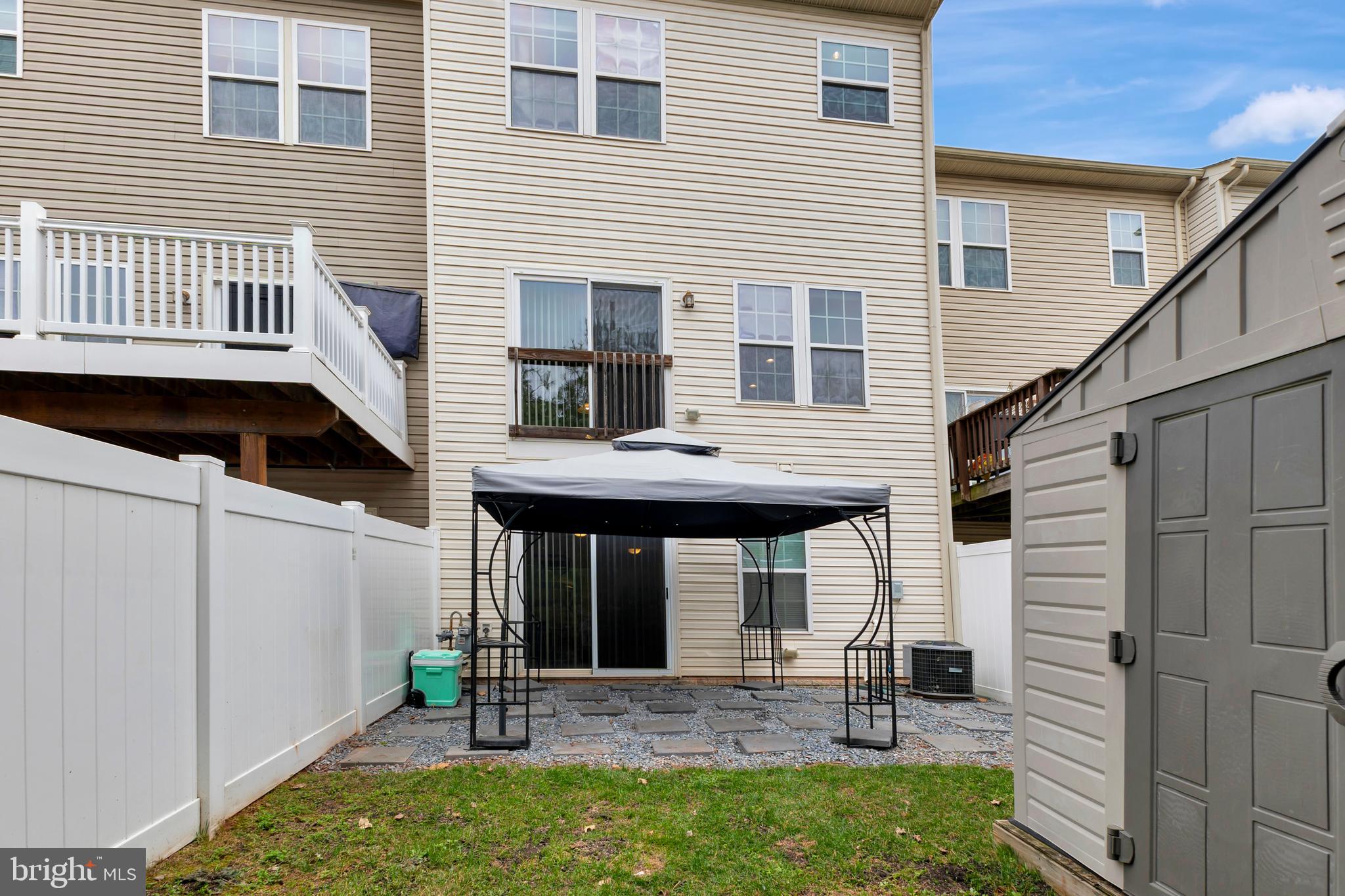 2063 Spring Run Circle Frederick, MD 21702 - Photo 27 of 28 a front view of a house with garden