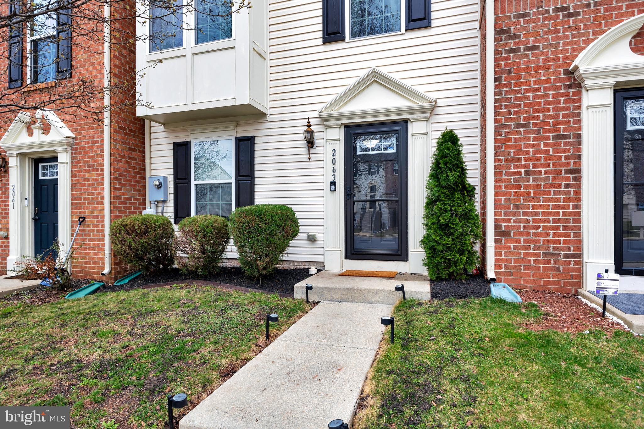 2063 Spring Run Circle Frederick, MD 21702 - Photo 4 of 28 a view of a house with a yard and plants