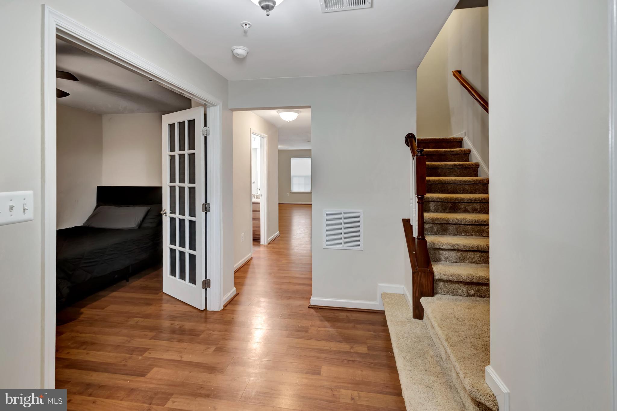 2063 Spring Run Circle Frederick, MD 21702 - Photo 5 of 28 a view of entryway and hall with wooden floor