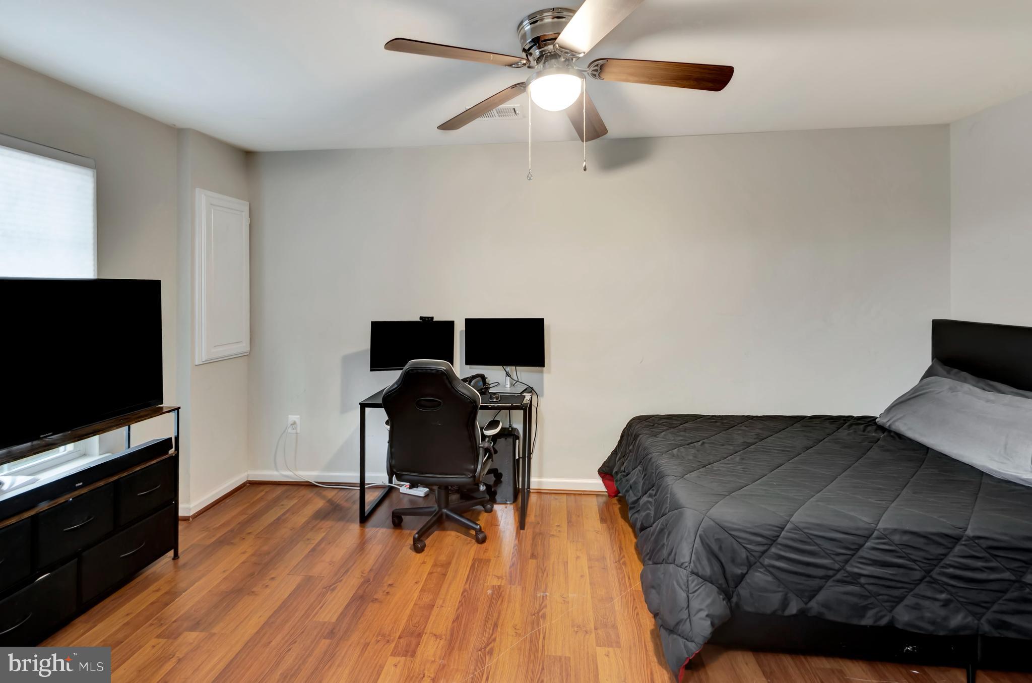 2063 Spring Run Circle Frederick, MD 21702 - Photo 6 of 28 a bedroom with a bed and a flat screen tv