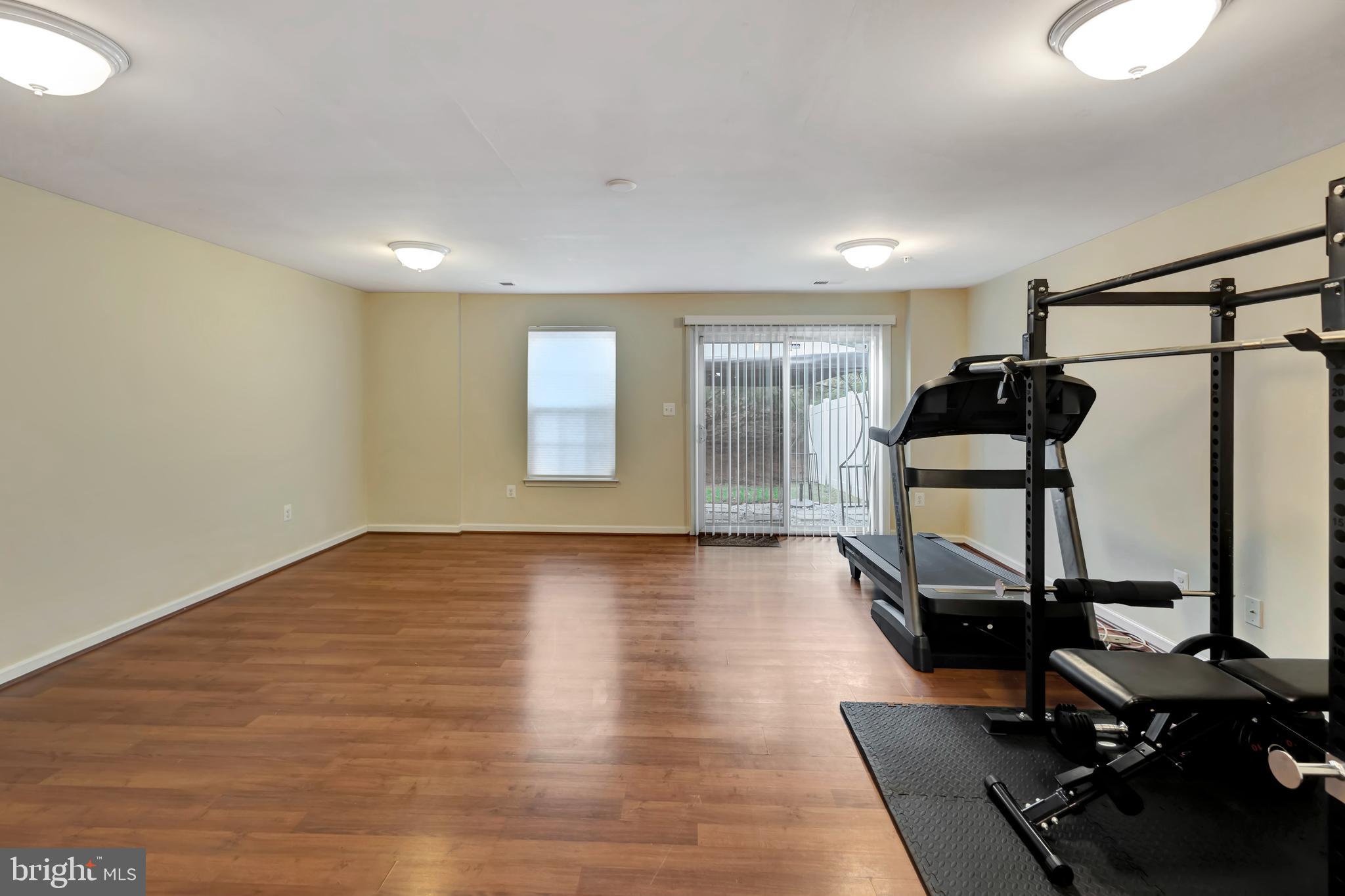 2063 Spring Run Circle Frederick, MD 21702 - Photo 9 of 28 a view of a room with gym equipment and a window