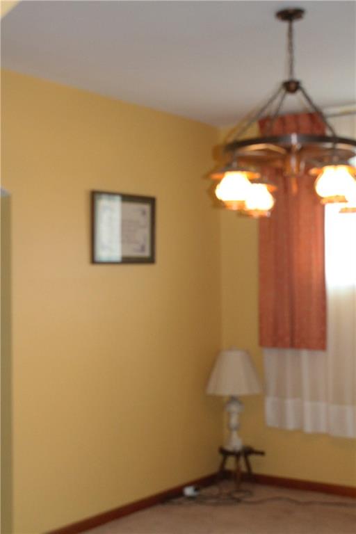 67 Warren Street Pittsburgh, PA 15205 - Photo 20 of 39 a view of a chandelier fan and wooden floor