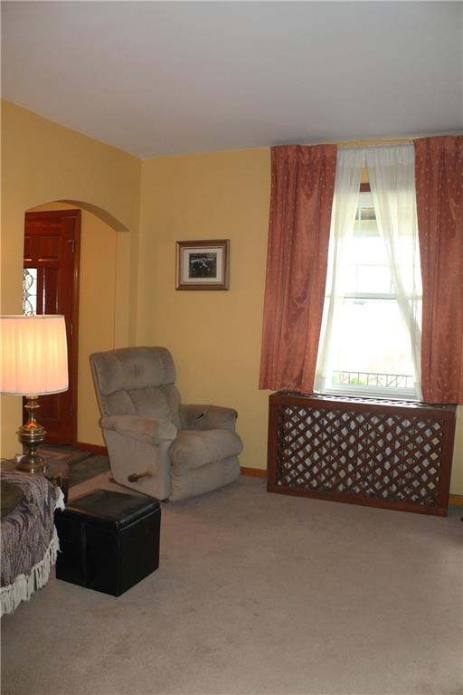 67 Warren Street Pittsburgh, PA 15205 - Photo 35 of 39 a living room with a couch wooden floor and a window