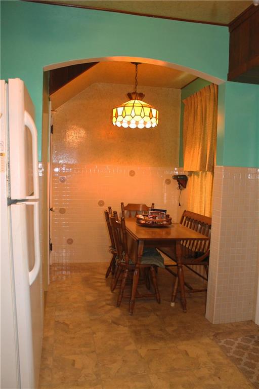 67 Warren Street Pittsburgh, PA 15205 - Photo 9 of 39 a view of a dining room with furniture and a window