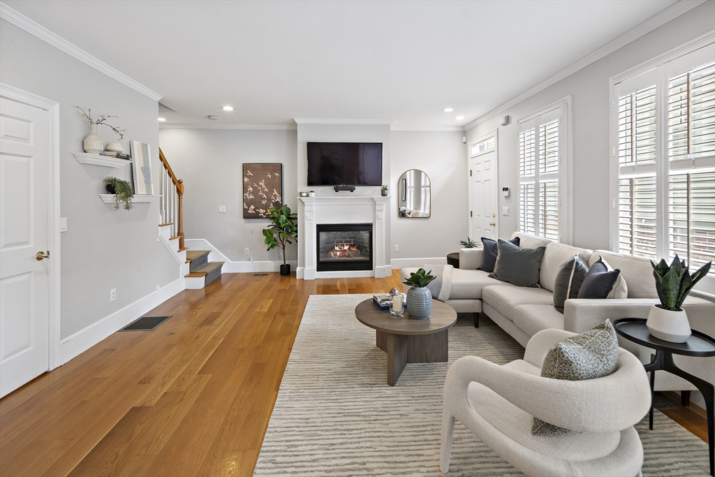 a living room with furniture fireplace and a flat screen tv