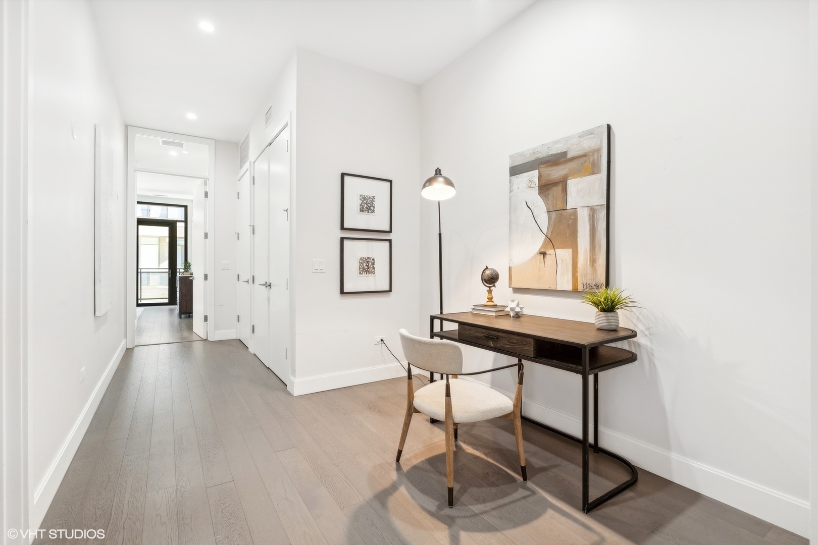 27 North Aberdeen Street, Unit 3N Chicago, IL 60607 - Photo 17 of 35 a view of a workspace with furniture and wooden floor