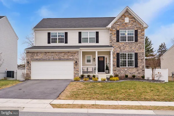 a front view of house with garage