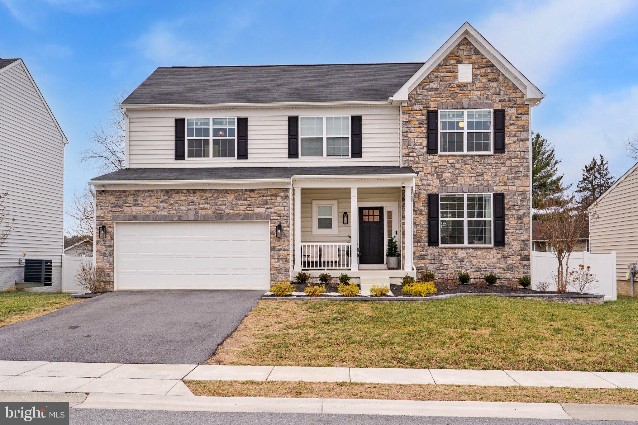 a front view of house with garage