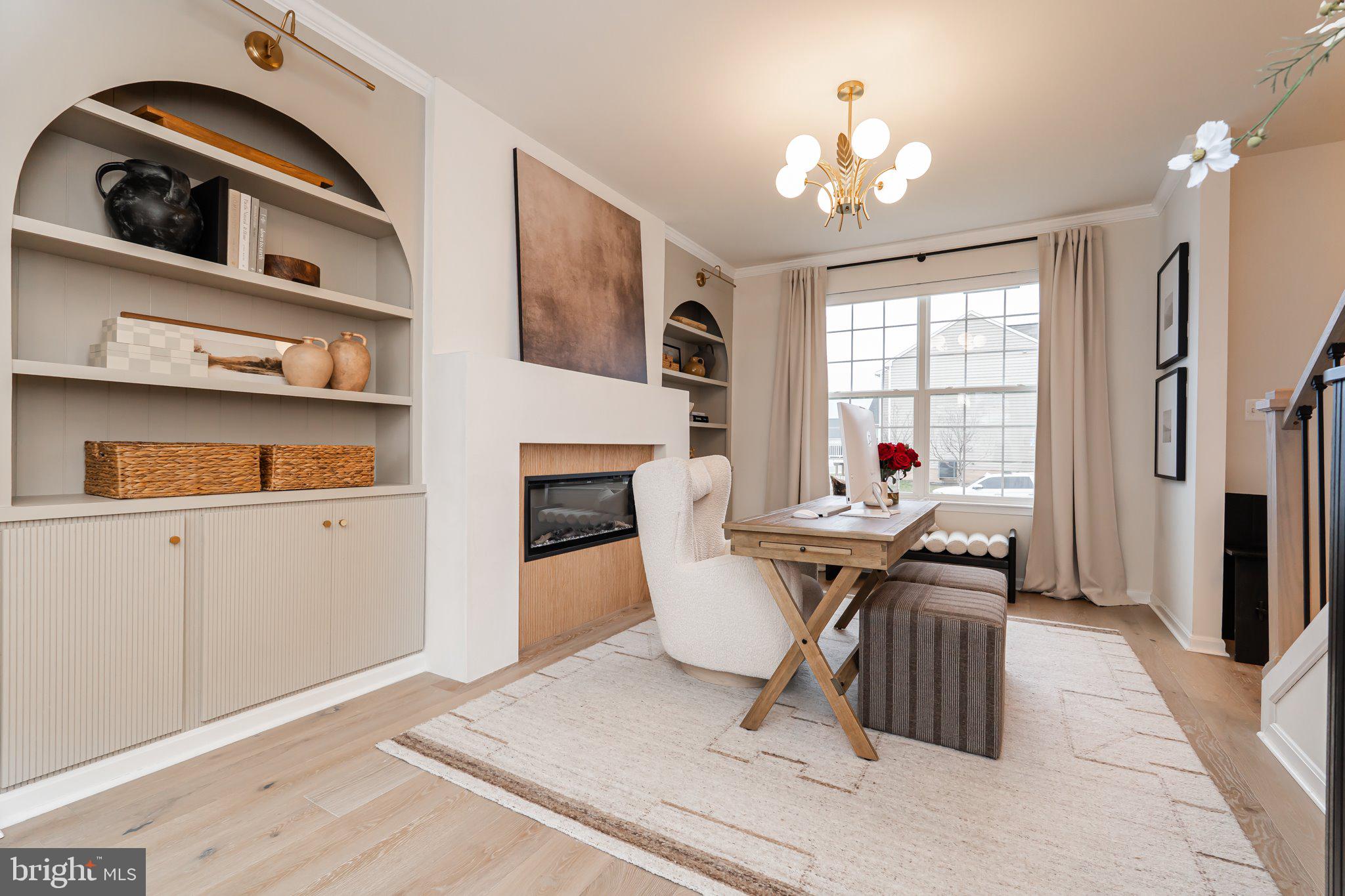 38 Deep Creek Road Ranson, WV 25438 - Photo 14 of 64 a living room with furniture a fireplace and a chandelier