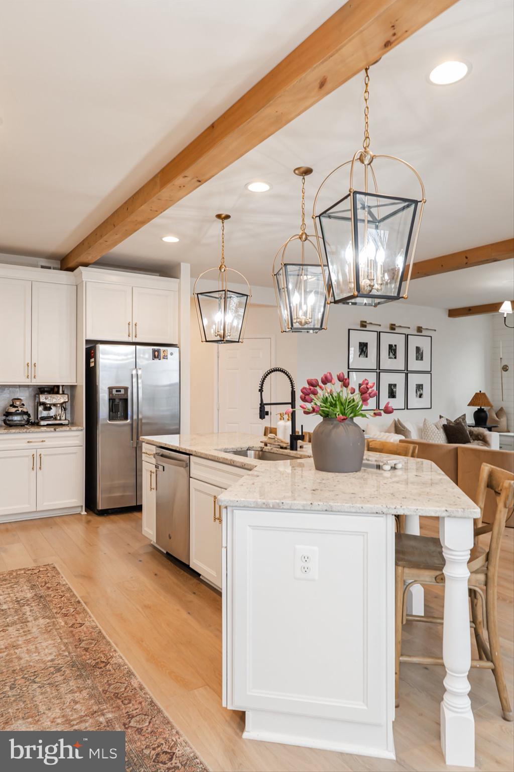 38 Deep Creek Road Ranson, WV 25438 - Photo 27 of 64 a kitchen with stainless steel appliances granite countertop a sink refrigerator and cabinets