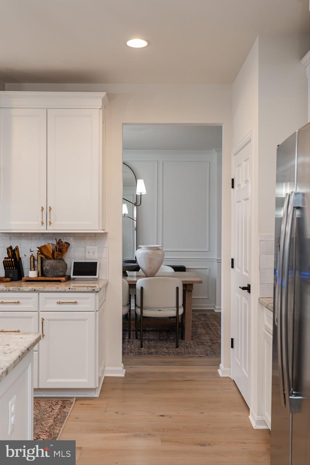 38 Deep Creek Road Ranson, WV 25438 - Photo 30 of 64 a living room with stainless steel appliances kitchen island granite countertop a table chairs sink and cabinets