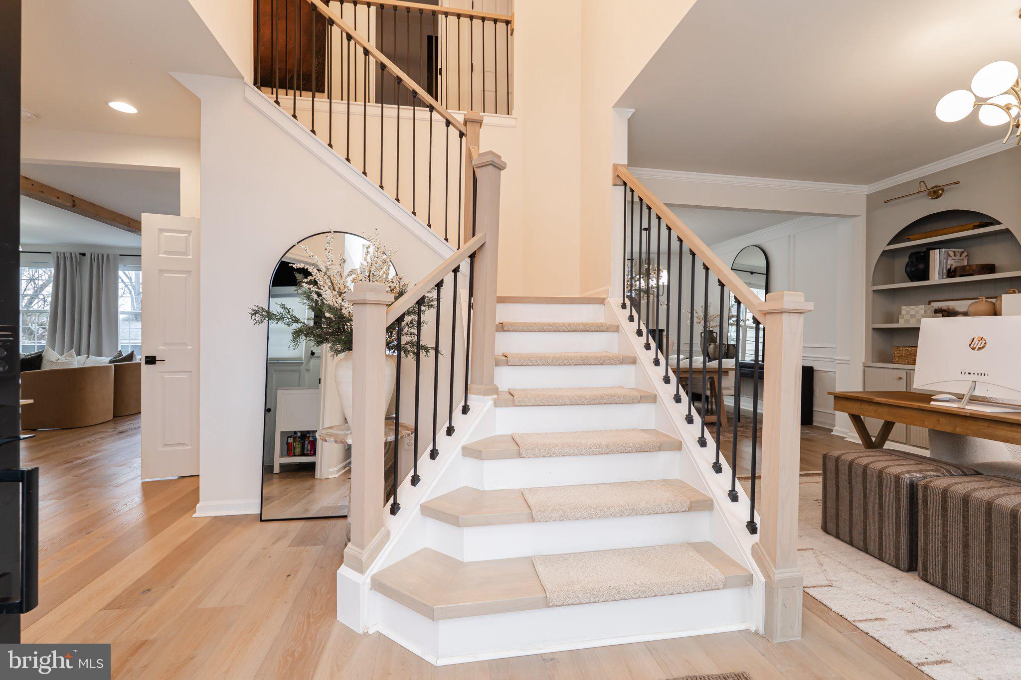 38 Deep Creek Road Ranson, WV 25438 - Photo 3 of 64 a view of staircase with lots of frames and couches