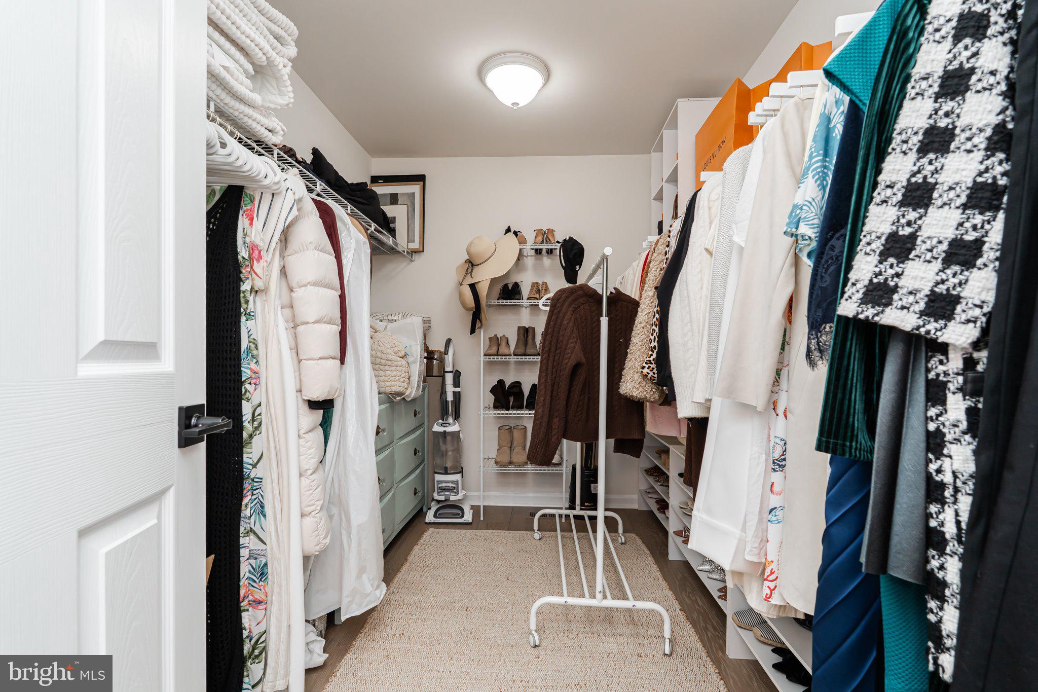 38 Deep Creek Road Ranson, WV 25438 - Photo 37 of 64 a view of walk in closet with clothes and shoes