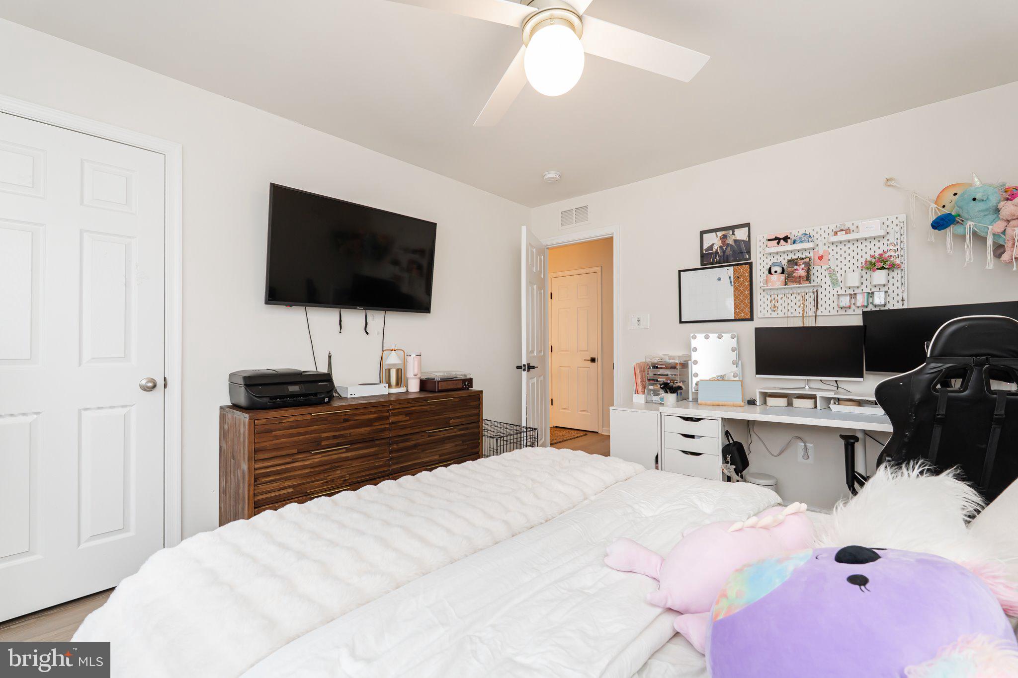 38 Deep Creek Road Ranson, WV 25438 - Photo 44 of 64 a bedroom with a bed and a flat screen tv