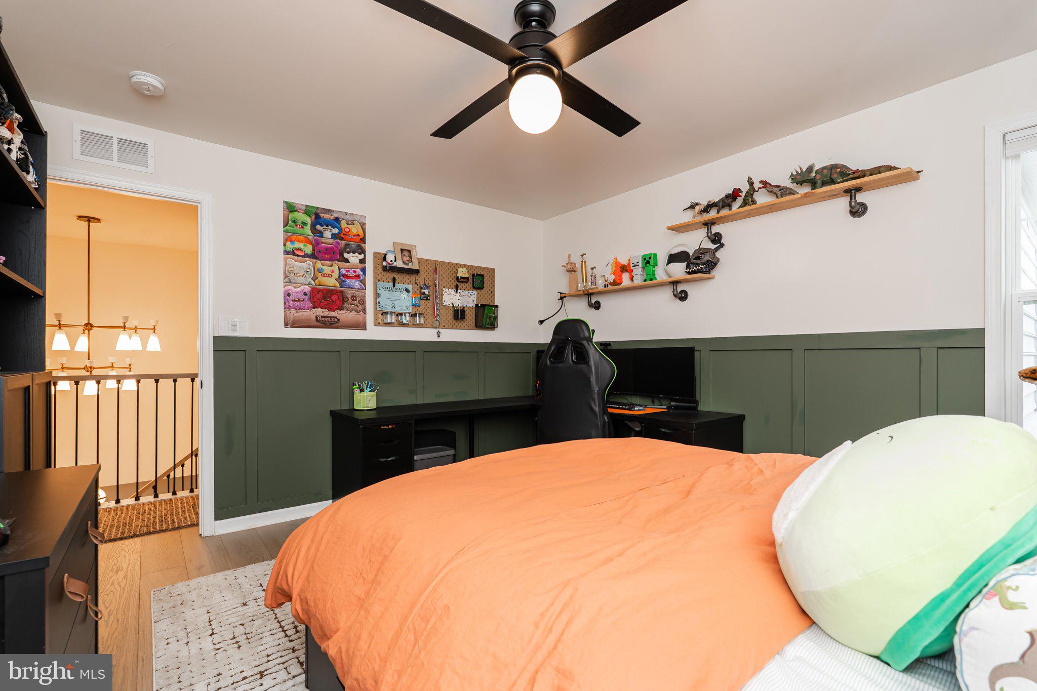 38 Deep Creek Road Ranson, WV 25438 - Photo 46 of 64 a bed room with a bed and a chandelier