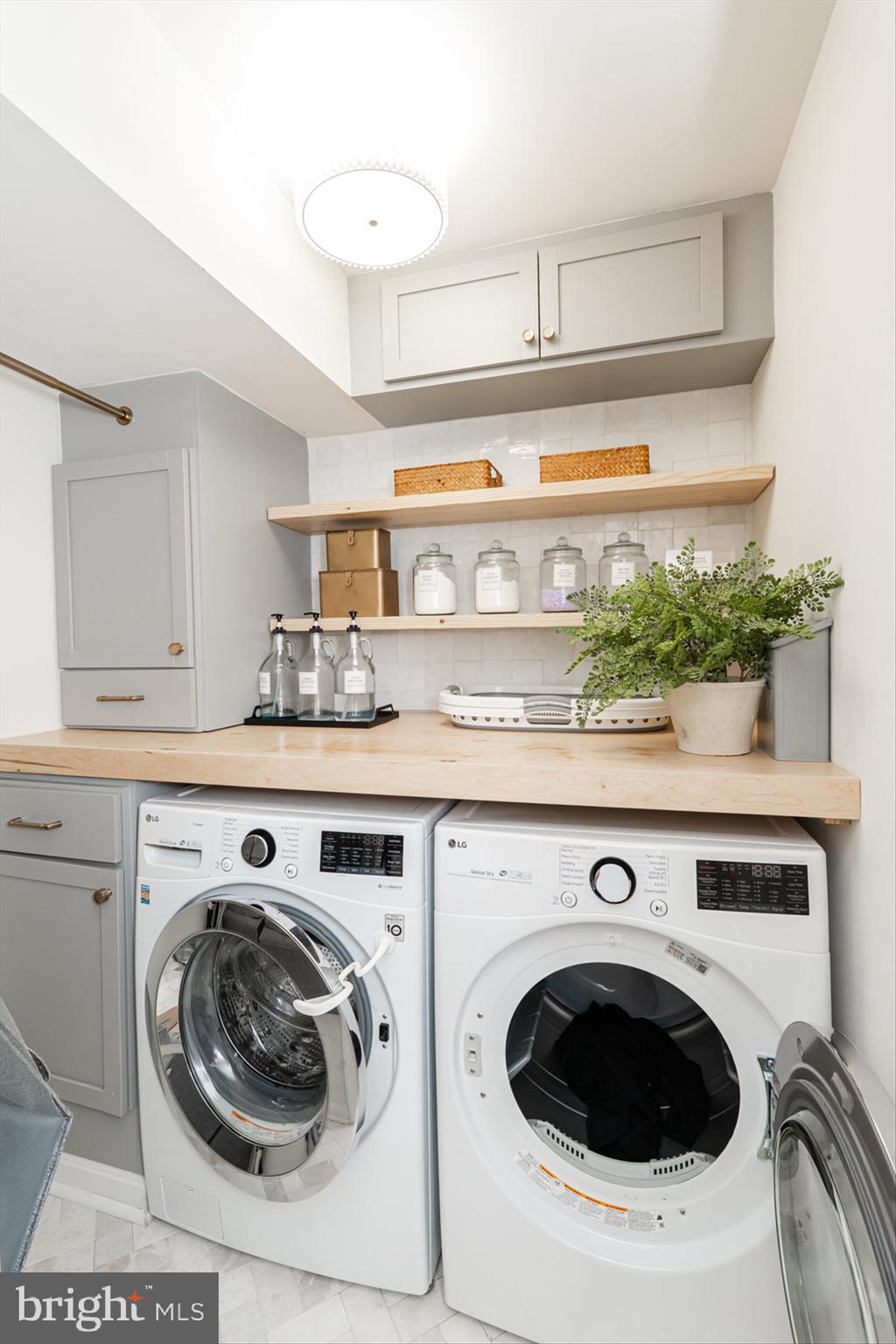 38 Deep Creek Road Ranson, WV 25438 - Photo 48 of 64 a utility room with sink dryer and washer