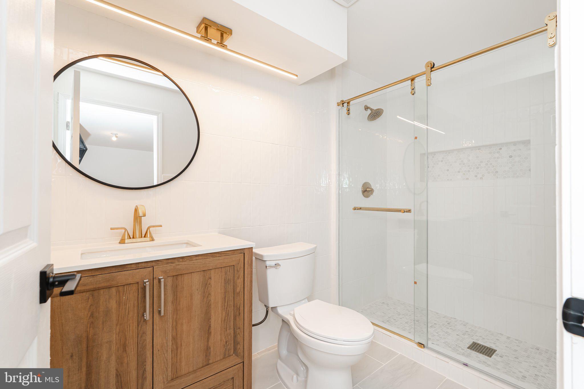 38 Deep Creek Road Ranson, WV 25438 - Photo 50 of 64 a bathroom with a sink a toilet and shower