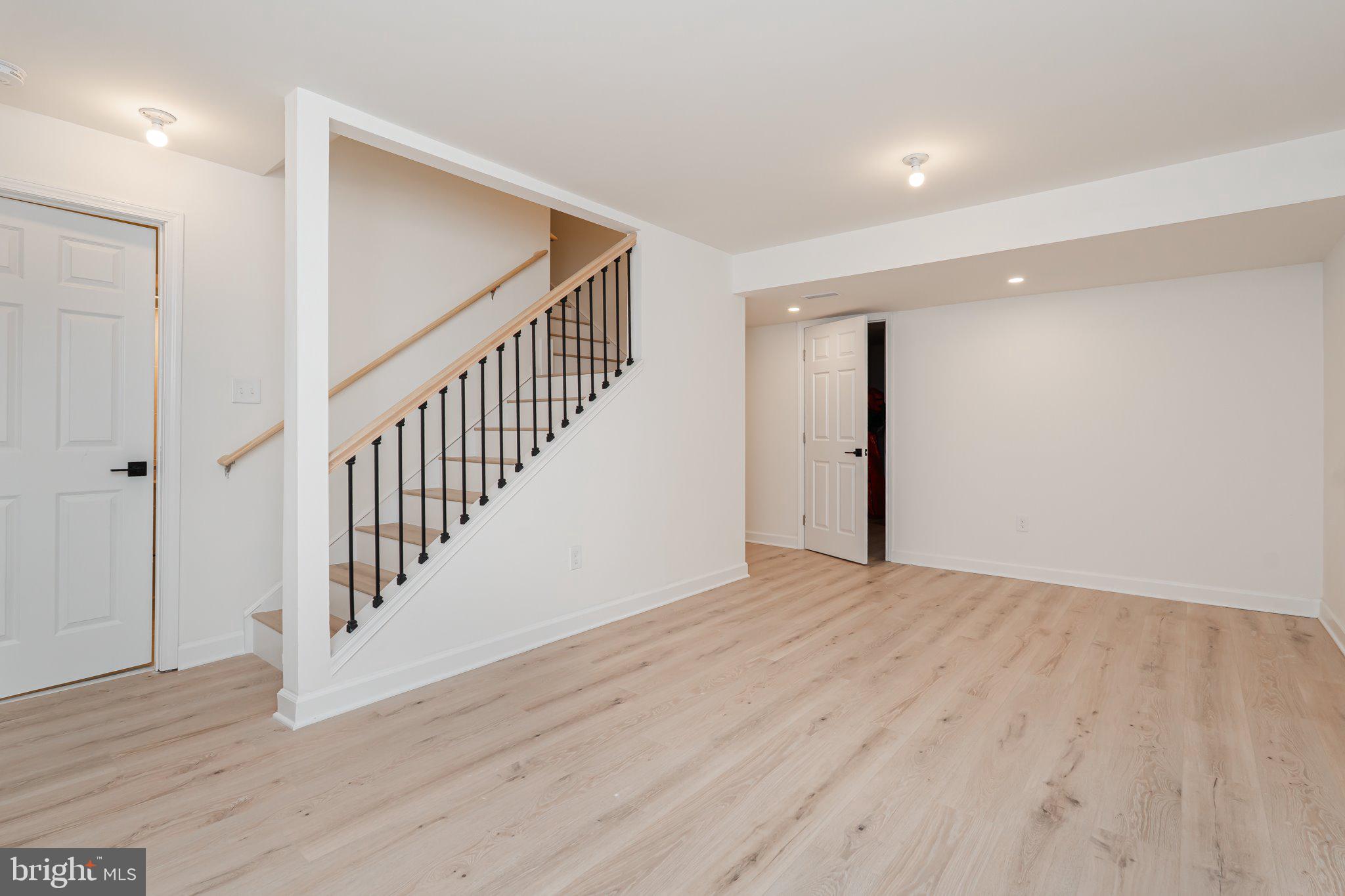 38 Deep Creek Road Ranson, WV 25438 - Photo 53 of 64 a view of an empty room with wooden floor and entryway