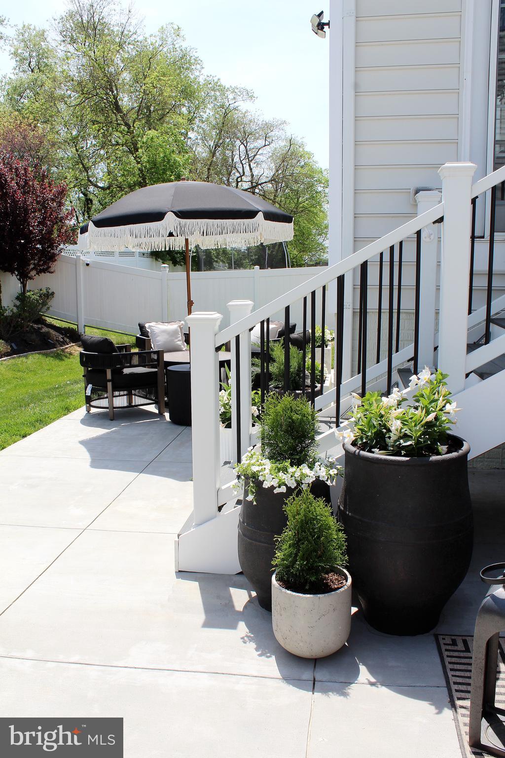 38 Deep Creek Road Ranson, WV 25438 - Photo 60 of 64 a view of a chair and table in backyard of the house