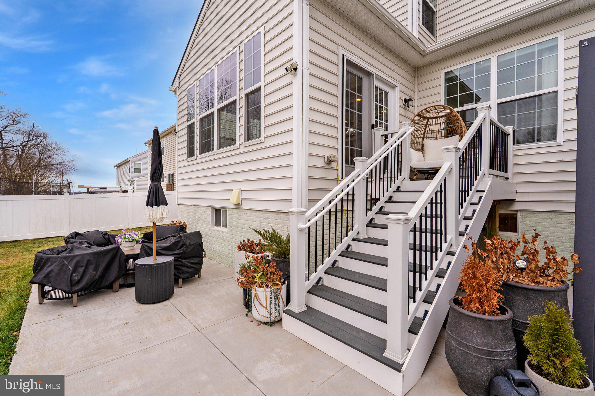 38 Deep Creek Road Ranson, WV 25438 - Photo 62 of 64 a view of a patio with two chairs and a potted plant