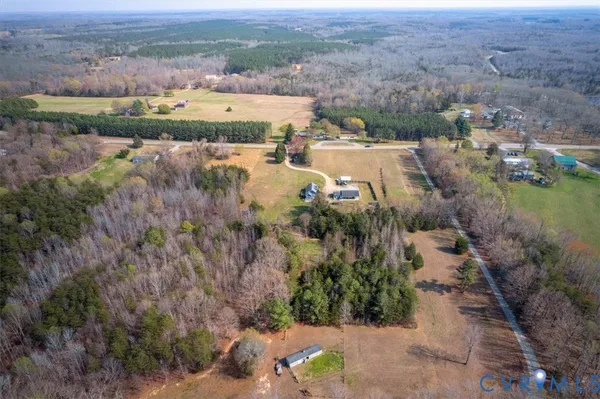 an aerial view of a house with lake view