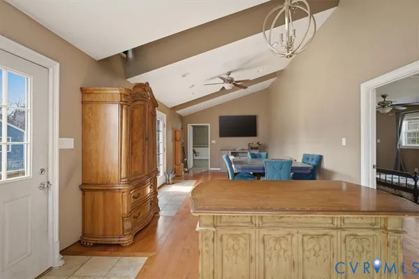 a kitchen with stainless steel appliances granite countertop a refrigerator a stove and a sink