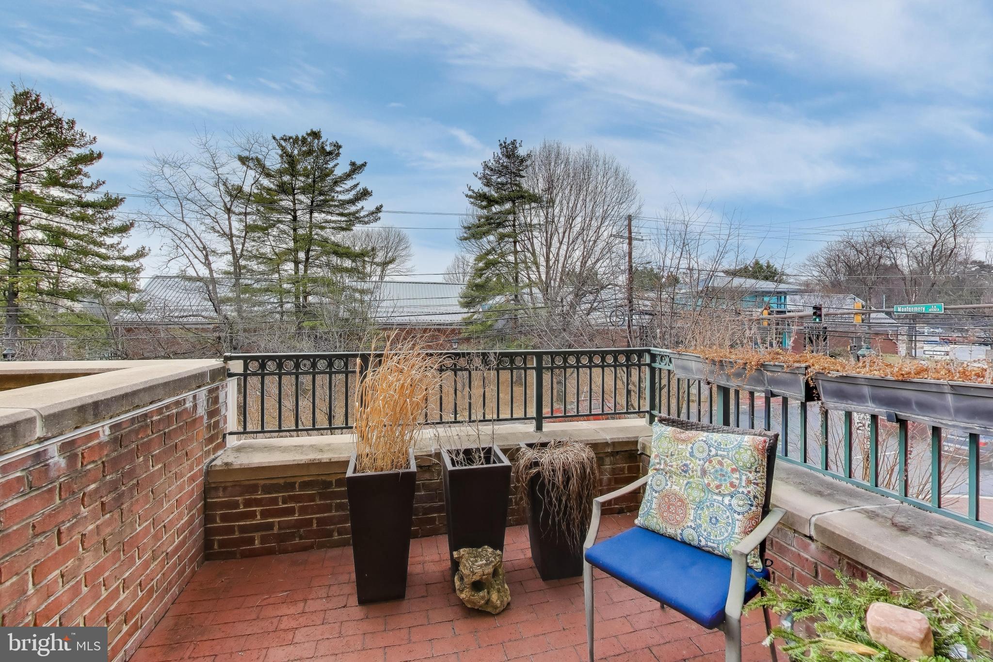 7405 Arlington Road, Unit 202 Bethesda, MD 20814 - Photo 19 of 41 Balcony with sunset view.