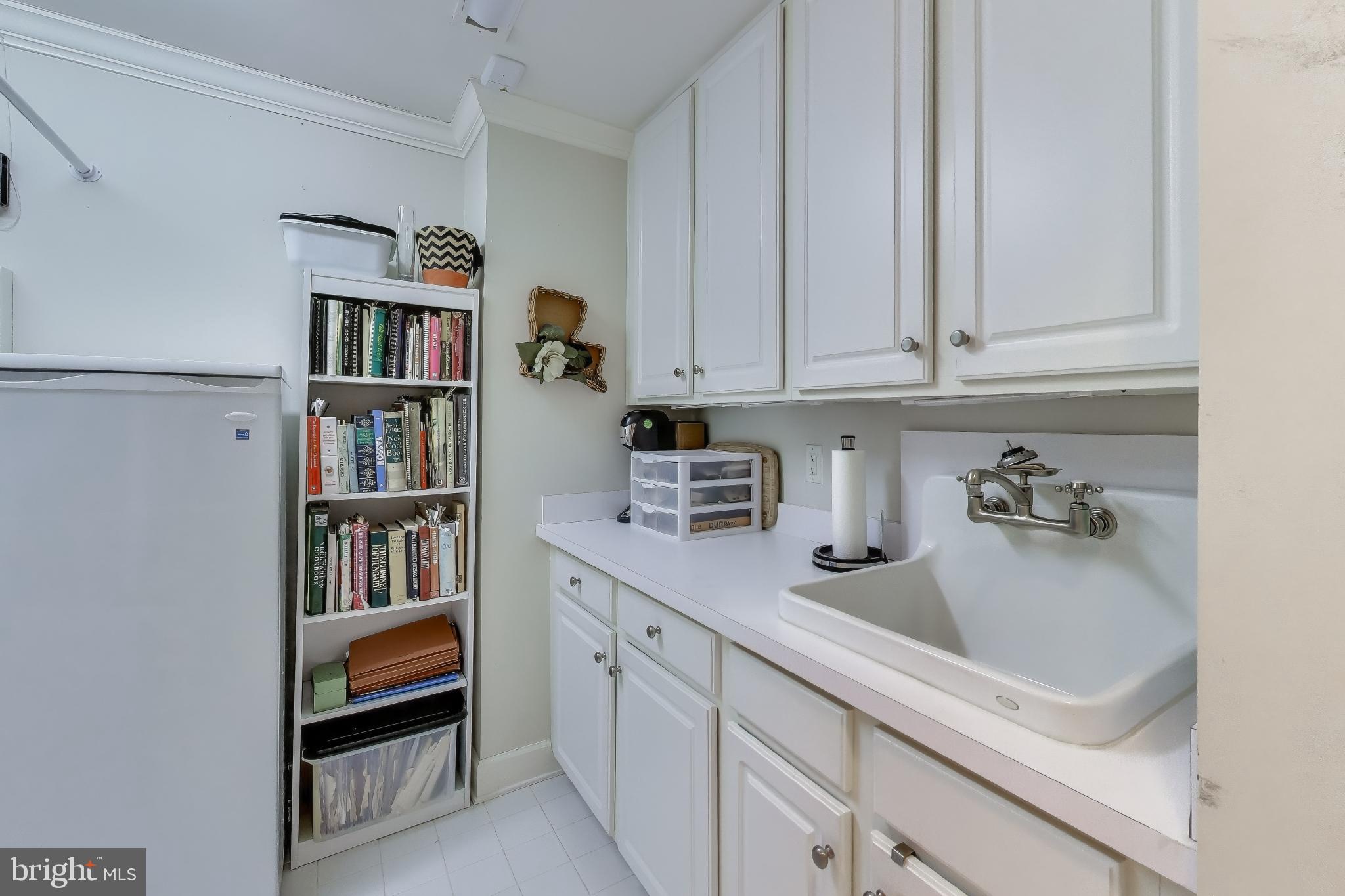 7405 Arlington Road, Unit 202 Bethesda, MD 20814 - Photo 35 of 41 Laundry room with extra storage
