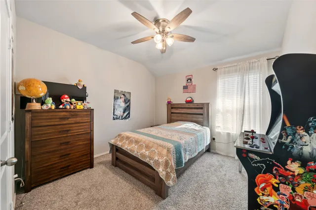 a bedroom with a bed and dresser