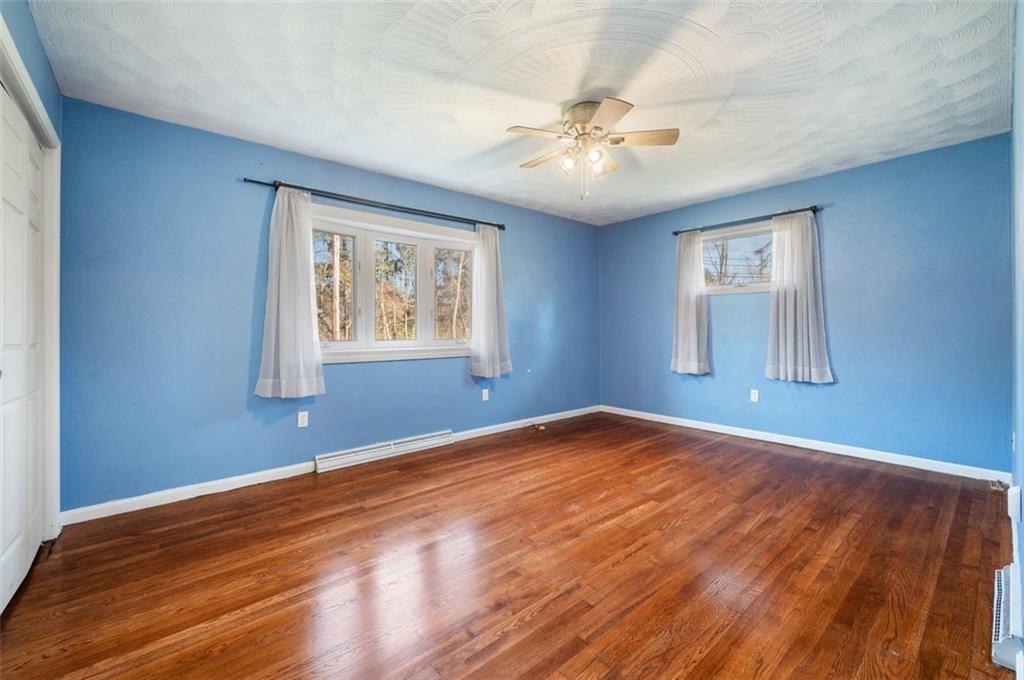 2425 Highway 30 Hookstown, PA 15050 - Photo 12 of 28 a view of an empty room with wooden floor and a window