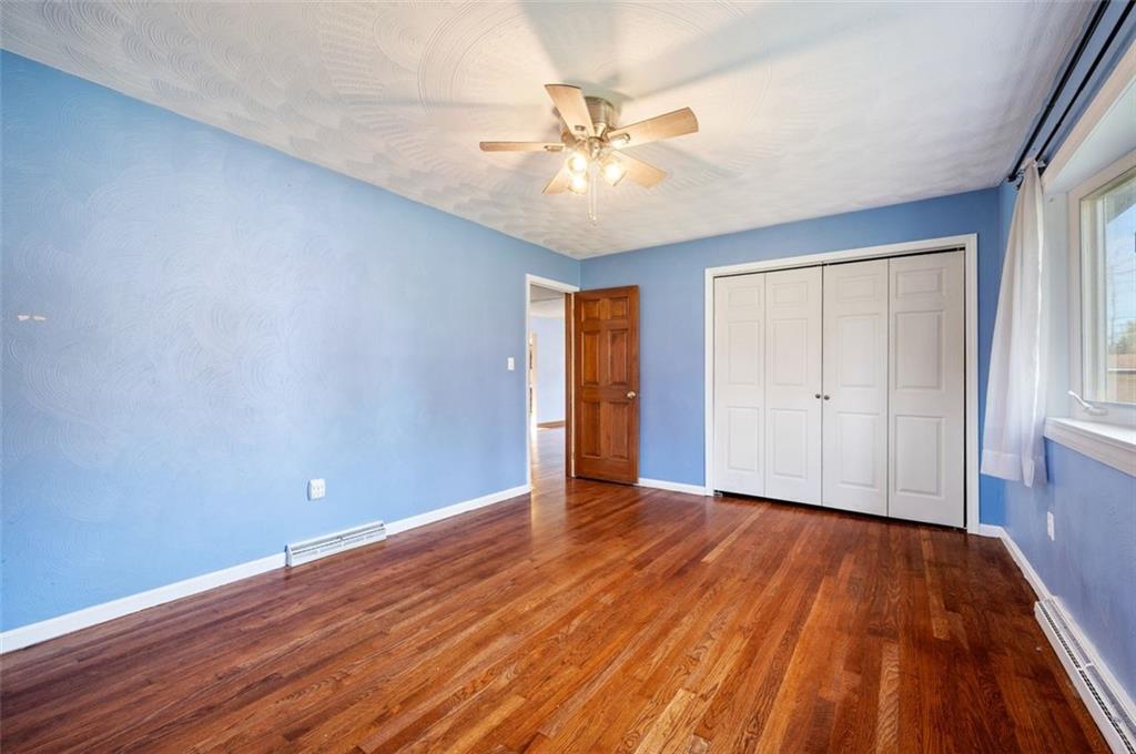 2425 Highway 30 Hookstown, PA 15050 - Photo 13 of 28 a view of an empty room with wooden floor and a window