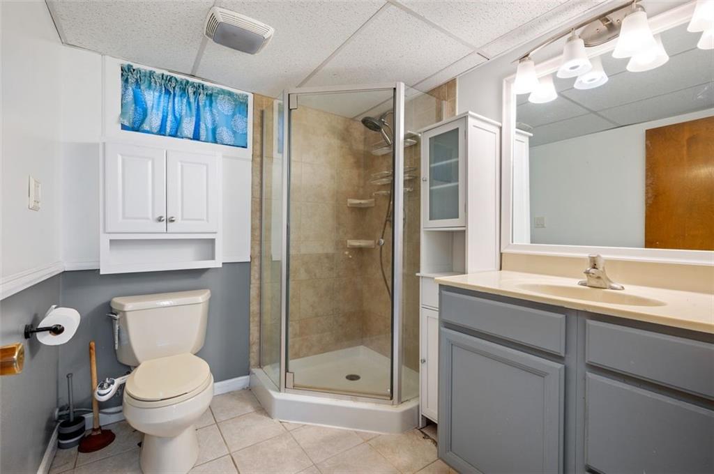2425 Highway 30 Hookstown, PA 15050 - Photo 21 of 28 a bathroom with a toilet a sink and glass door