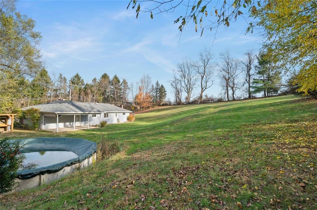2425 Highway 30 Hookstown, PA 15050 - Photo 27 of 28 a view of a white house with a yard and outdoor space