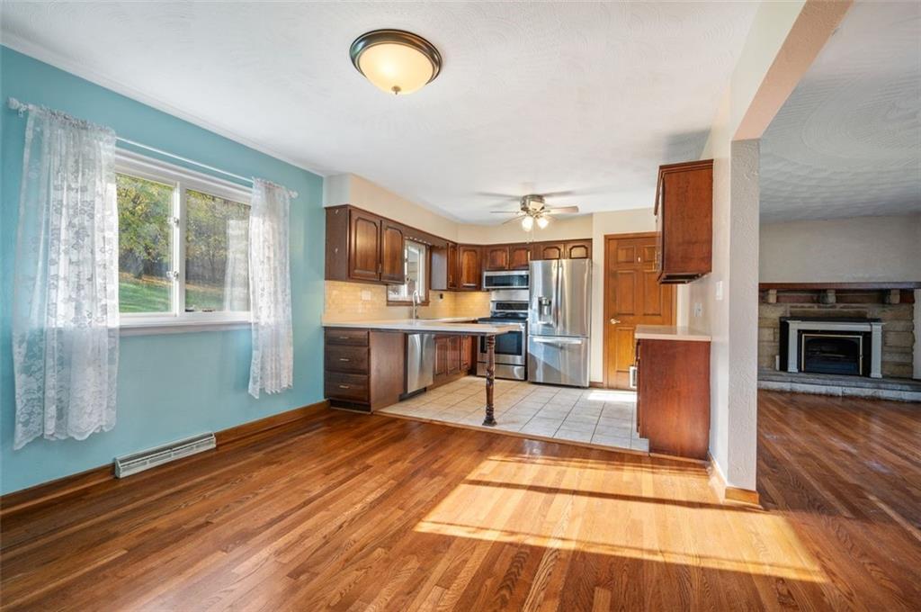 2425 Highway 30 Hookstown, PA 15050 - Photo 5 of 28 a view of a kitchen with furniture and a fireplace
