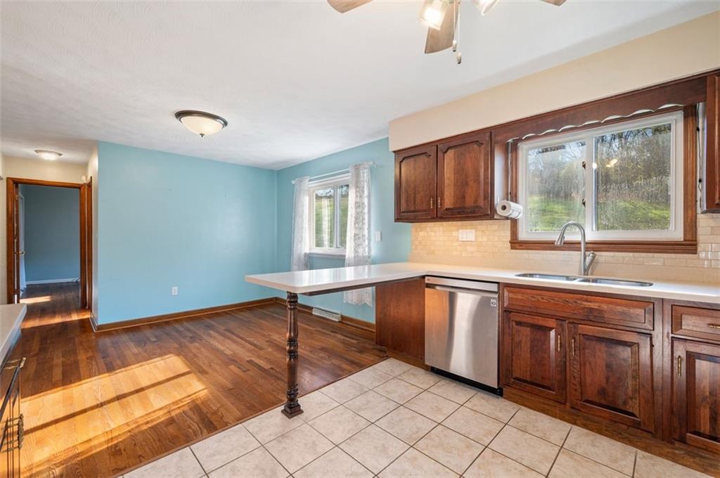 2425 Highway 30 Hookstown, PA 15050 - Photo 9 of 28 a kitchen with granite countertop a sink and cabinets