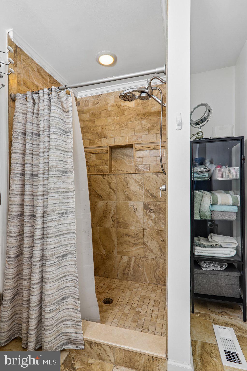 3103 Walnut Street Northeast Washington, DC 20018 - Photo 35 of 40 Sleek shower with elegant tile design.
