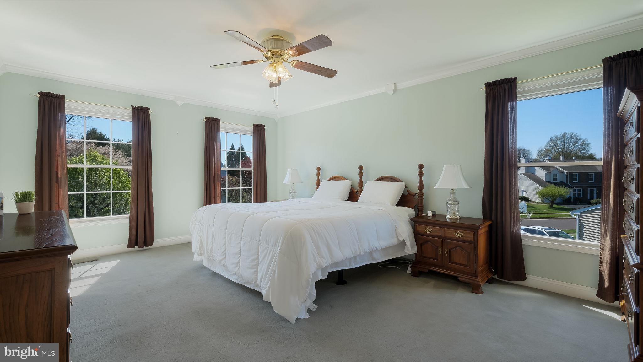 9 Caldwell Circle Newtown, PA 18940 - Photo 16 of 29 a spacious bedroom with a bed painting and a large window