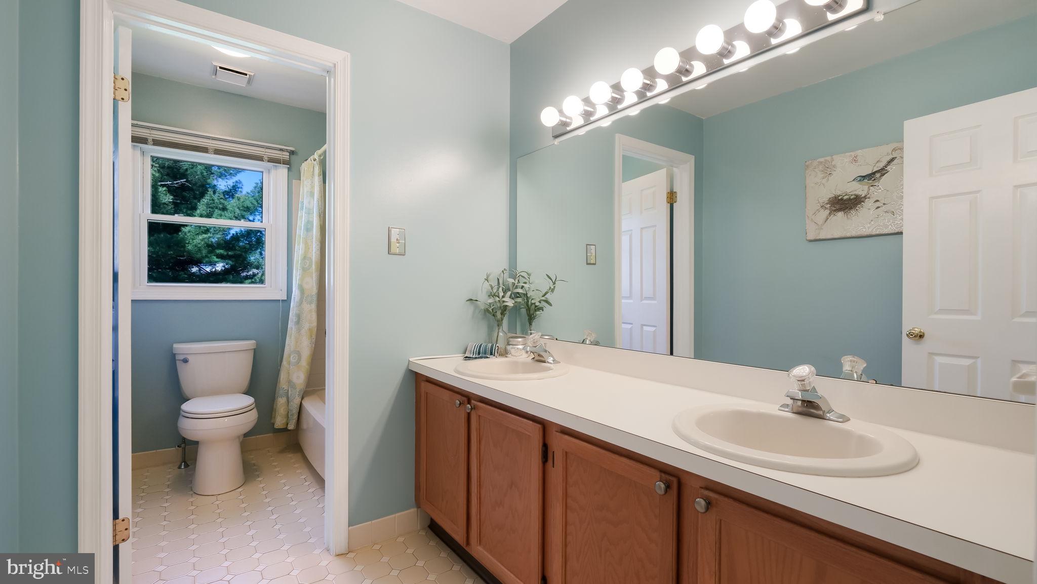 9 Caldwell Circle Newtown, PA 18940 - Photo 23 of 29 a bathroom with a toilet sink and mirror