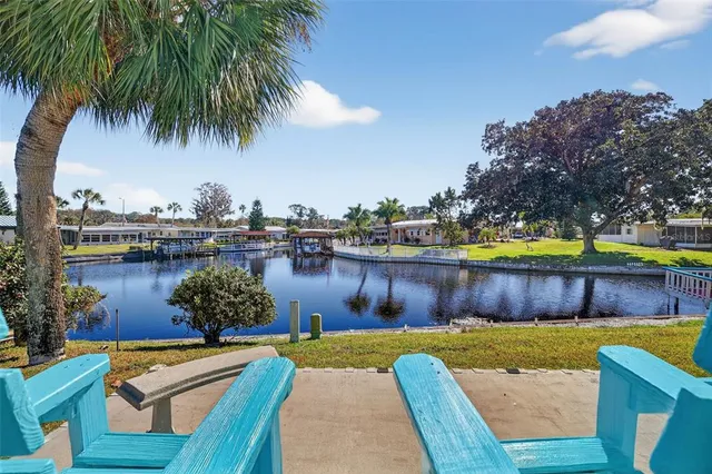 a swimming pool with outdoor seating and yard