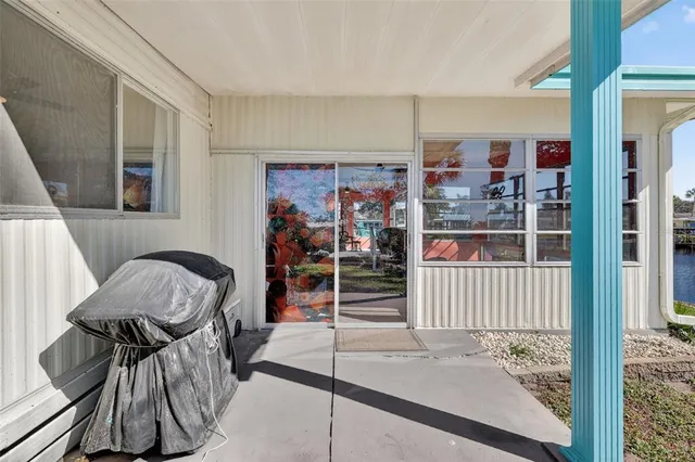 a view of a hallway with furniture and carpet